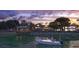 Picturesque waterfront property with a dock, gazebo, boat, and stunning sunset views at 27 Rebellion Rd, Charleston, SC 29407
