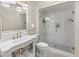 Bright bathroom featuring a glass-enclosed shower, a classic vanity, and elegant gold fixtures at 286 Meeting St # C, Charleston, SC 29407