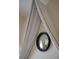 Close-up of a bedroom canopy bed featuring a stylish round mirror, enhancing the room's elegance and charm at 286 Meeting St # C, Charleston, SC 29407
