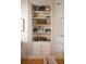 Built-in bookcase with stylish decor and storage cabinets in a well-lit room at 286 Meeting St # C, Charleston, SC 29407
