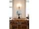 Bright dining area featuring wood floors, a long table, stylish chairs and decor at 286 Meeting St # C, Charleston, SC 29407