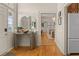 Inviting entryway with hardwood floors, transom windows, and a decorative table at 286 Meeting St # C, Charleston, SC 29407