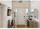 Welcoming entryway with natural light from the windows above the front door at 286 Meeting St # C, Charleston, SC 29407