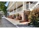 This luxury home has an outdoor fountain and mature shrubbery offering shade and curb appeal at 286 Meeting St # C, Charleston, SC 29407