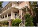 Beautiful home featuring staircases to stacked porches with stately white columns at 286 Meeting St # C, Charleston, SC 29407