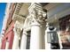Architectural details with ornate columns, a classic lantern, and brick accents, adding character to the building's facade at 286 Meeting St # C, Charleston, SC 29407