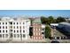 A three-story brick home with many windows sits between two streets in an urban setting at 286 Meeting St # C, Charleston, SC 29407