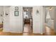 Hallway view into a kitchen and bedroom with stylish design and lighting at 286 Meeting St # C, Charleston, SC 29407