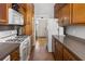 Kitchen featuring wood cabinets, counter tops, and an opening to the foyer at 286 Meeting St # C, Charleston, SC 29407