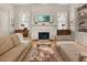 Bright living room showcasing a fireplace, built-in shelves, and neutral paint colors at 286 Meeting St # C, Charleston, SC 29407