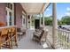 Spacious outdoor porch with comfortable seating, providing a relaxing and inviting atmosphere with a view at 286 Meeting St # C, Charleston, SC 29407