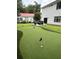 Backyard putting green and outdoor seating area for ultimate outdoor enjoyment at 31 Wedgepark Rd, Charleston, SC 29407