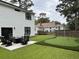 Backyard with patio seating, fire pit, and a putting green for recreation at 31 Wedgepark Rd, Charleston, SC 29407