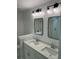 Bright bathroom featuring double sinks, quartz countertops, and modern lighting at 31 Wedgepark Rd, Charleston, SC 29407