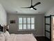 Bright bedroom features a ceiling fan, white shutters on the window and a sliding door at 31 Wedgepark Rd, Charleston, SC 29407