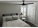 Comfortable bedroom with a ceiling fan, wooden floors, a window with blinds, and a neutral color scheme at 31 Wedgepark Rd, Charleston, SC 29407