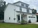 Charming, modern farmhouse with a two-car garage and professionally landscaped yard at 31 Wedgepark Rd, Charleston, SC 29407