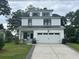 Charming, modern farmhouse with a two-car garage and professionally landscaped yard at 31 Wedgepark Rd, Charleston, SC 29407