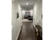 Hallway view of the living room, showcasing the home's open floor plan and hardwood flooring at 31 Wedgepark Rd, Charleston, SC 29407