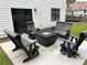 Cozy patio with modern seating around a fire pit, perfect for outdoor gatherings at 31 Wedgepark Rd, Charleston, SC 29407
