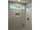 Modern shower features white subway tile, a glass door, and a window for natural light at 31 Wedgepark Rd, Charleston, SC 29407