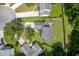 Aerial view of a home with a firepit and outdoor seating in a manicured lawn in a quiet neighborhood at 3202 Middleburry Ln, Charleston, SC 29414