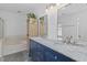 Bright bathroom featuring double sink vanity, marble countertop and modern fixtures at 3202 Middleburry Ln, Charleston, SC 29414