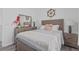 Bedroom featuring a nautical-themed decor, bed with white and blue bedding, and a wooden headboard at 3202 Middleburry Ln, Charleston, SC 29414