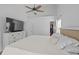 Cozy primary bedroom with neutral decor, soft lighting, and convenient access to the en-suite bathroom at 3202 Middleburry Ln, Charleston, SC 29414