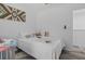 Bedroom with a crib and a twin bed featuring a decorative accent wall at 3202 Middleburry Ln, Charleston, SC 29414