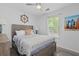 Bright bedroom with surfboard art, nautical decorations, and a comfortable bed with soft linens at 3202 Middleburry Ln, Charleston, SC 29414