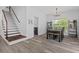 Open concept dining area featuring modern light fixture, next to the home's stairway at 3202 Middleburry Ln, Charleston, SC 29414
