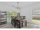 Rustic wood dining table with seating for six near a window with natural light at 3202 Middleburry Ln, Charleston, SC 29414
