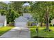 Charming two-story home with a well-manicured lawn, attached garage, and inviting curb appeal at 3202 Middleburry Ln, Charleston, SC 29414