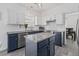 Bright kitchen features white and blue cabinets, granite countertops, and stainless steel appliances at 3202 Middleburry Ln, Charleston, SC 29414
