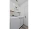 Modern laundry room is equipped with a newer washer and dryer plus upper storage cabinets at 3202 Middleburry Ln, Charleston, SC 29414