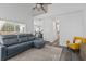 Open-concept living area with vaulted ceilings, sleek floors, and seamless flow to the kitchen at 3202 Middleburry Ln, Charleston, SC 29414