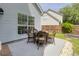 Relaxing patio with wicker furniture, perfect for outdoor dining and entertaining on a concrete porch at 3202 Middleburry Ln, Charleston, SC 29414