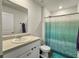 Functional bathroom with a vanity, mirror, and shower with a decorative curtain at 386 Spruce Ivy St, Moncks Corner, SC 29461