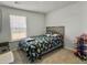 Neutral bedroom featuring a window and closet for storage at 386 Spruce Ivy St, Moncks Corner, SC 29461