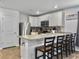 Modern kitchen featuring white cabinets, stainless steel appliances, and a stylish backsplash at 386 Spruce Ivy St, Moncks Corner, SC 29461