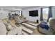 Bright and inviting living room with plush sofas, a large TV, and an open layout at 386 Spruce Ivy St, Moncks Corner, SC 29461