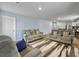 Cozy living room with neutral-toned sofas, a patterned rug, and plenty of space for relaxation at 386 Spruce Ivy St, Moncks Corner, SC 29461