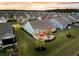 The aerial view showcases a home with a large, well-kept lawn and outdoor living space at 467 Hidden Meadow Ln, Summerville, SC 29486