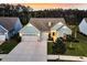 Aerial view showcasing the property's well-manicured lawn, driveway, and landscaping features at 467 Hidden Meadow Ln, Summerville, SC 29486