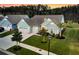Aerial view showcasing the property's well-manicured lawn, driveway, and landscaping features at 467 Hidden Meadow Ln, Summerville, SC 29486