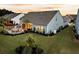 This backyard boasts an outdoor kitchen, patio, firepit, and well-manicured lawn at 467 Hidden Meadow Ln, Summerville, SC 29486