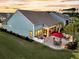 Outdoor patio with seating area, built-in grill, and lush green lawn perfect for entertaining at 467 Hidden Meadow Ln, Summerville, SC 29486