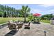 Spacious backyard patio with a fire pit and lounge chairs, perfect for outdoor entertaining at 467 Hidden Meadow Ln, Summerville, SC 29486
