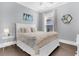 Bedroom with gray walls, white bed frame, hardwood floors, and decor at 467 Hidden Meadow Ln, Summerville, SC 29486
